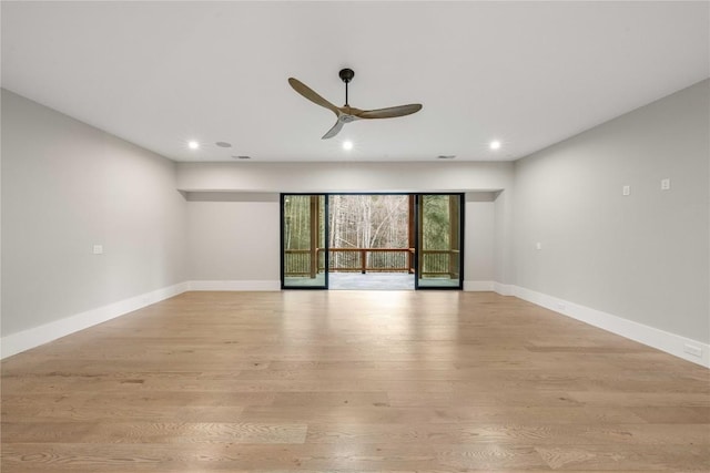 unfurnished room featuring a ceiling fan, recessed lighting, light wood-style flooring, and baseboards