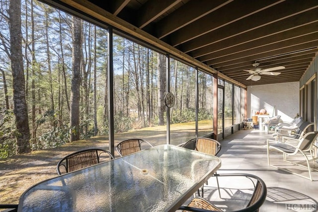 sunroom featuring ceiling fan