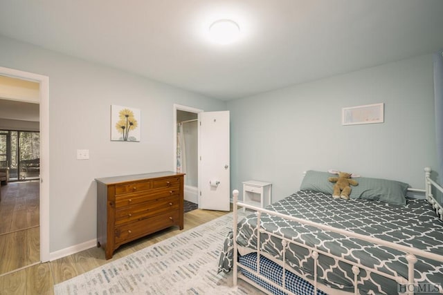 bedroom with light wood-type flooring