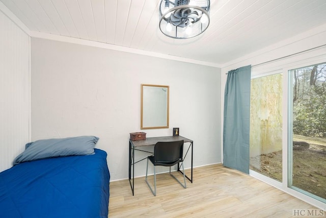 bedroom with ornamental molding, wood ceiling, and light hardwood / wood-style flooring