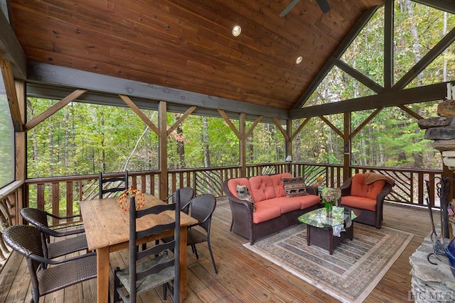 wooden deck with ceiling fan and outdoor lounge area