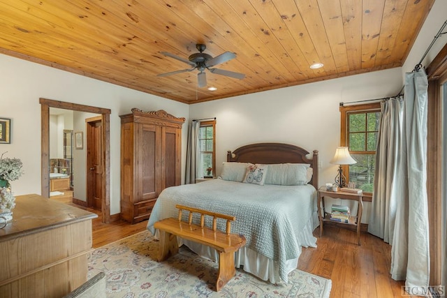 bedroom featuring ensuite bath, wooden ceiling, ceiling fan, and light hardwood / wood-style flooring