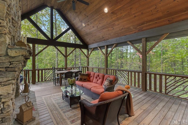 wooden deck with an outdoor hangout area and ceiling fan