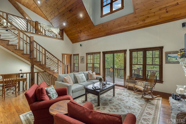 living room with hardwood / wood-style flooring, wooden ceiling, and high vaulted ceiling