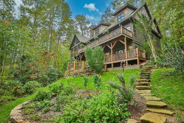 back of house with a balcony