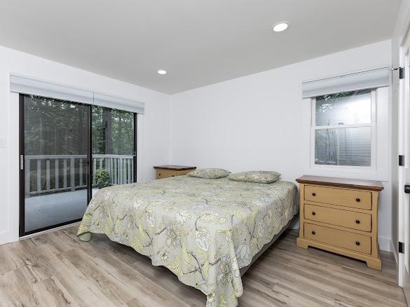49 Kiwi Ln Unit 14, Sapphire, NC 28774 - bedroom with access to outside, light wood-style flooring, and recessed lighting