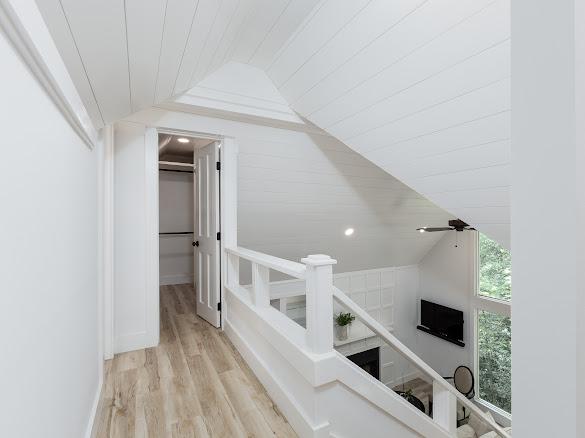 49 Kiwi Ln Unit 14, Sapphire, NC 28774 - hallway with lofted ceiling, wood finished floors, an upstairs landing, and wood ceiling