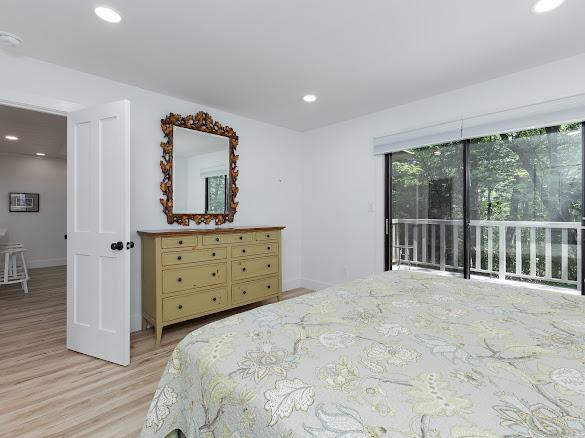49 Kiwi Ln Unit 14, Sapphire, NC 28774 - bedroom with light wood-type flooring, recessed lighting, and access to outside