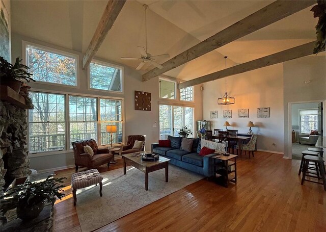 258 Club Colony Ln, Lake Toxaway, NC 28747 - living area with high vaulted ceiling, wood finished floors, beamed ceiling, plenty of natural light, and ceiling fan