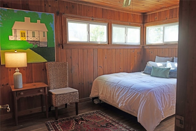 bedroom featuring wood ceiling, wood finished floors, and wood walls