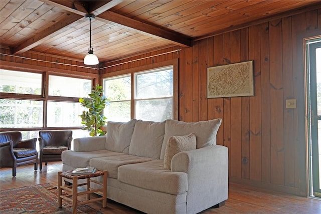 living room featuring beam ceiling, wood ceiling, and wood finished floors