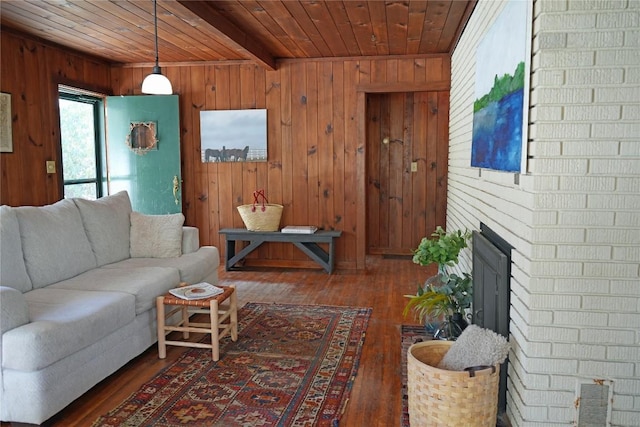 living room featuring wood walls, wooden ceiling, a fireplace, and hardwood / wood-style flooring