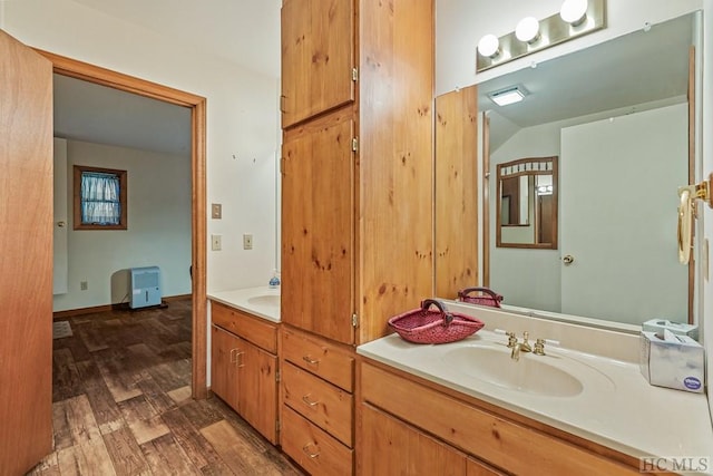 bathroom with vanity and hardwood / wood-style floors