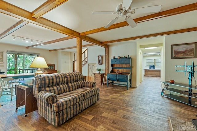 living room with beamed ceiling, hardwood / wood-style floors, track lighting, and ceiling fan