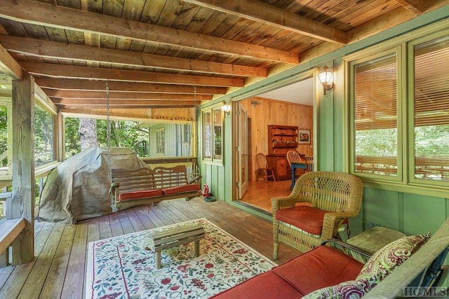 sunroom with beamed ceiling and wooden ceiling