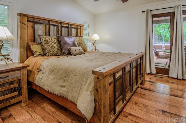 bedroom featuring vaulted ceiling, ceiling fan, and light wood-type flooring