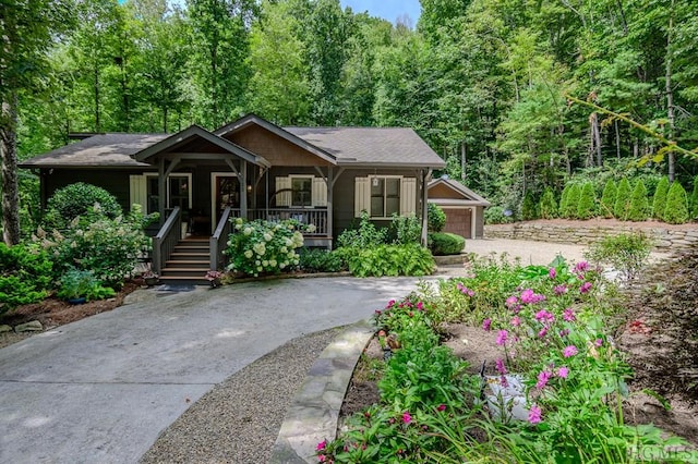 view of front of house featuring a porch and a garage