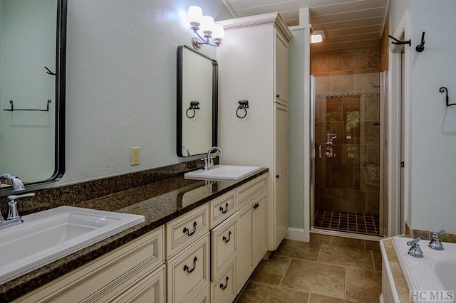 bathroom featuring vanity and independent shower and bath