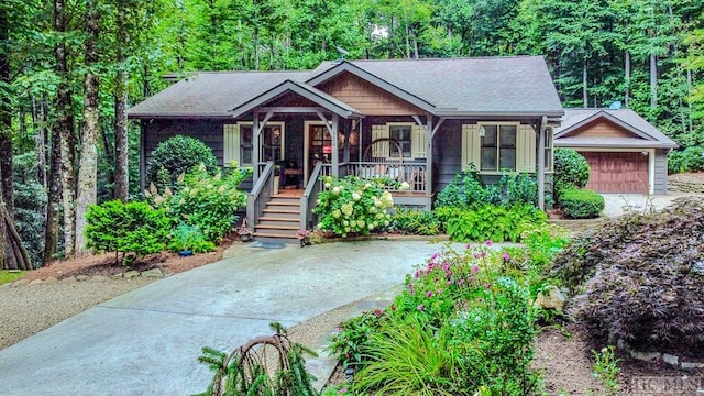 view of front facade with a garage and covered porch