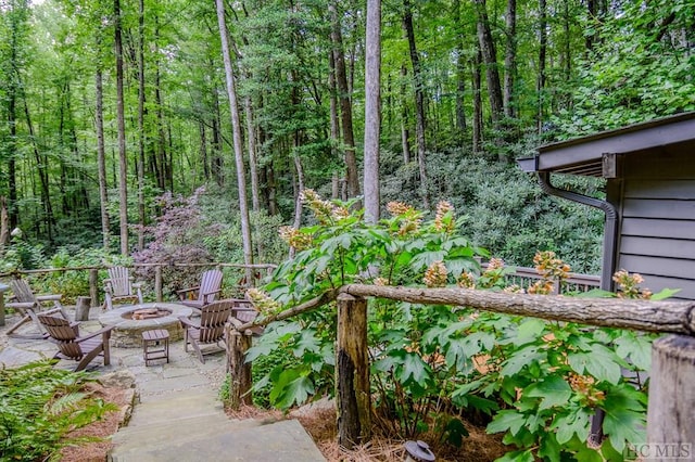 view of patio / terrace featuring an outdoor fire pit