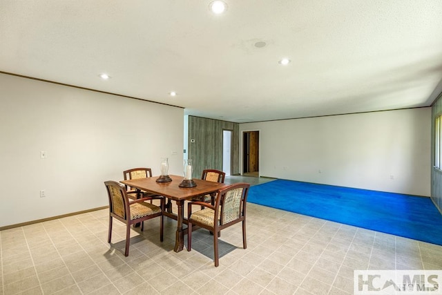 dining space with recessed lighting and baseboards
