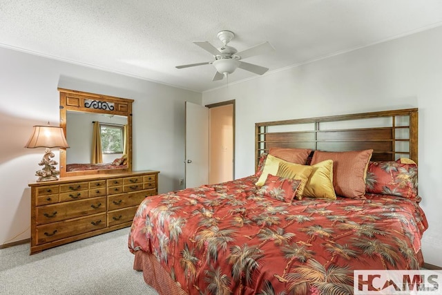 bedroom featuring ornamental molding, carpet flooring, and ceiling fan