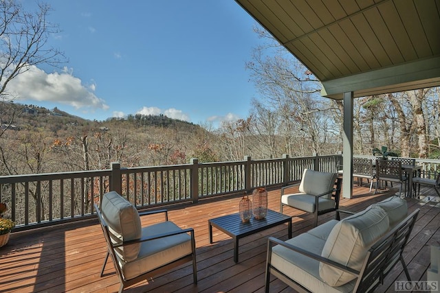 wooden deck with an outdoor hangout area