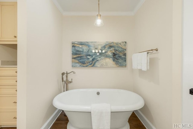 bathroom featuring a bathtub, wood-type flooring, and ornamental molding