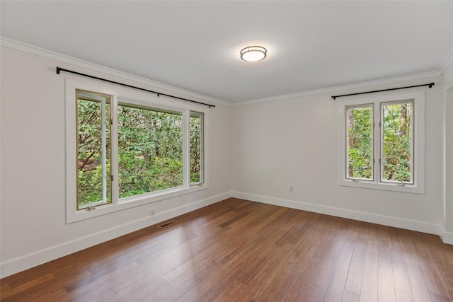 66 Hemlock Ln, Highlands, NC 28741 - spare room with baseboards, healthy amount of natural light, crown molding, and wood finished floors