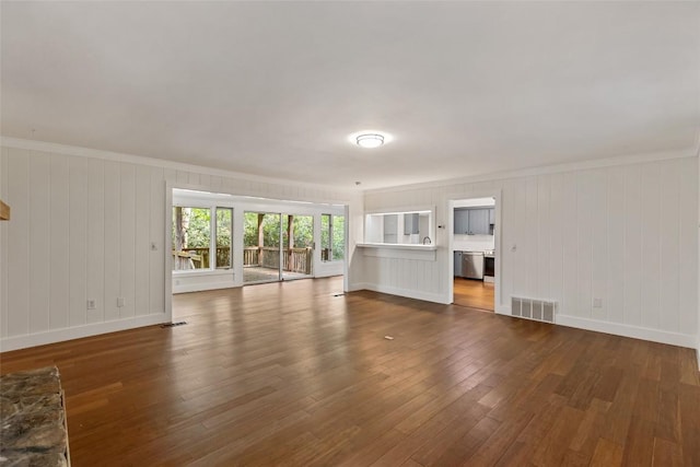 66 Hemlock Ln, Highlands, NC 28741 - unfurnished living room featuring dark wood-style flooring, baseboards, and ornamental molding