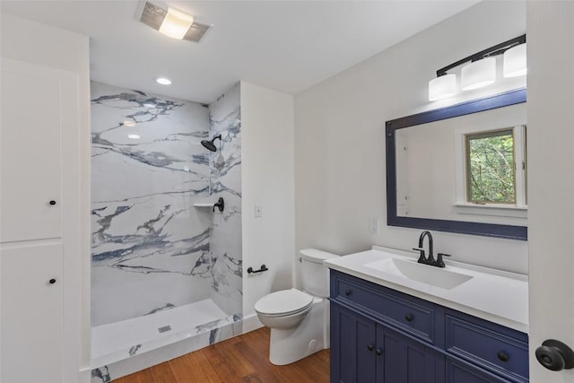 66 Hemlock Ln, Highlands, NC 28741 - full bath with a marble finish shower, vanity, toilet, and wood finished floors