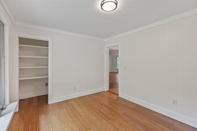 66 Hemlock Ln, Highlands, NC 28741 - unfurnished bedroom featuring crown molding, light wood finished floors, baseboards, and a closet