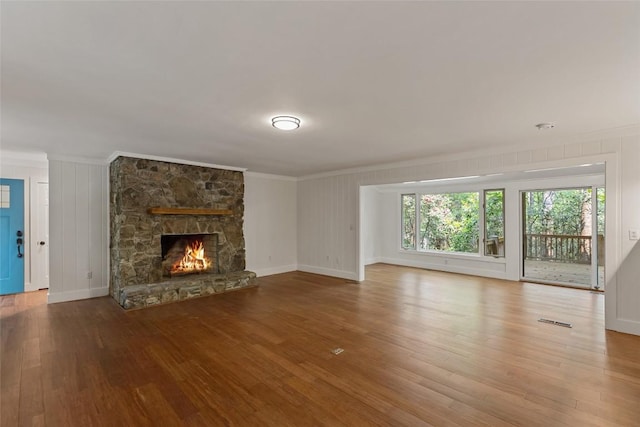 66 Hemlock Ln, Highlands, NC 28741 - unfurnished living room with ornamental molding, wood finished floors, a fireplace, and baseboards