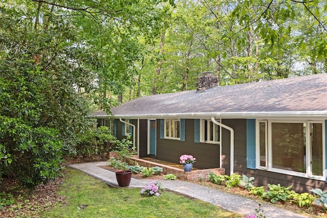 66 Hemlock Ln, Highlands, NC 28741 - single story home featuring a chimney and roof with shingles