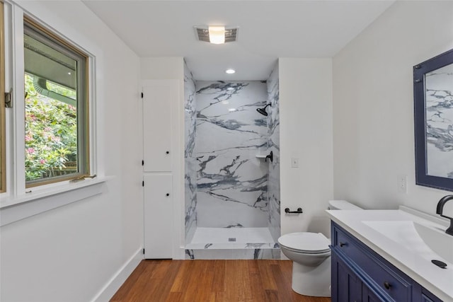 66 Hemlock Ln, Highlands, NC 28741 - bathroom with a marble finish shower, vanity, wood finished floors, and toilet