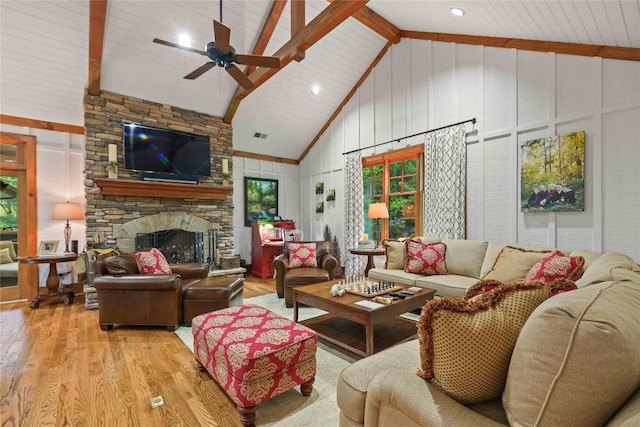 392 Birchwood Dr Unit 392, Highlands, NC 28741 - living room with wood finished floors, ceiling fan, high vaulted ceiling, beam ceiling, and a stone fireplace