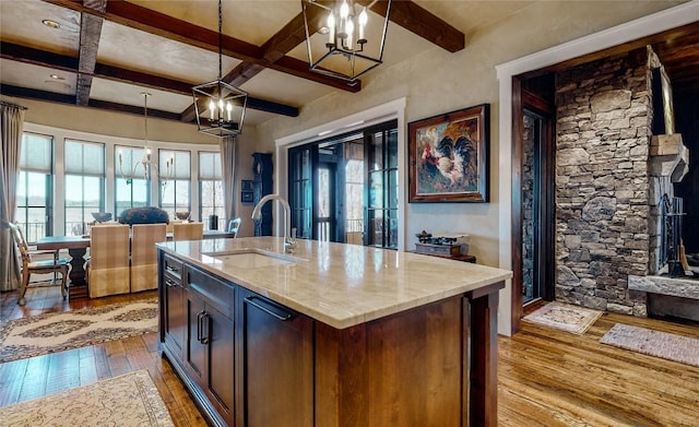 39 Firesong Ln, Glenville, NC 28736 - kitchen featuring light wood finished floors, a chandelier, coffered ceiling, beamed ceiling, and pendant lighting