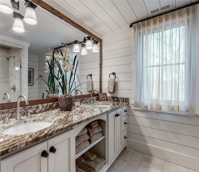 39 Firesong Ln, Glenville, NC 28736 - full bath with double vanity, a shower stall, wood walls, and tile patterned floors