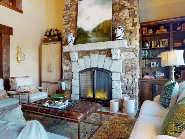 39 Firesong Ln, Glenville, NC 28736 - living area with a stone fireplace and wood finished floors