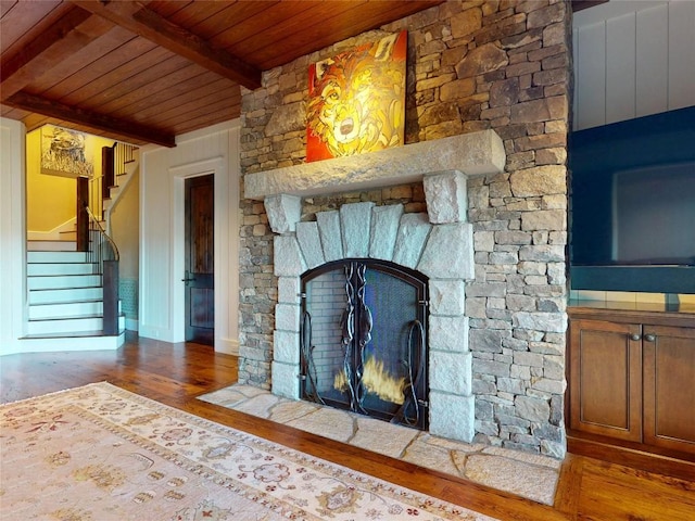 39 Firesong Ln, Glenville, NC 28736 - unfurnished living room with a wooden ceiling with exposed beams, a fireplace, wood finished floors, and stairs