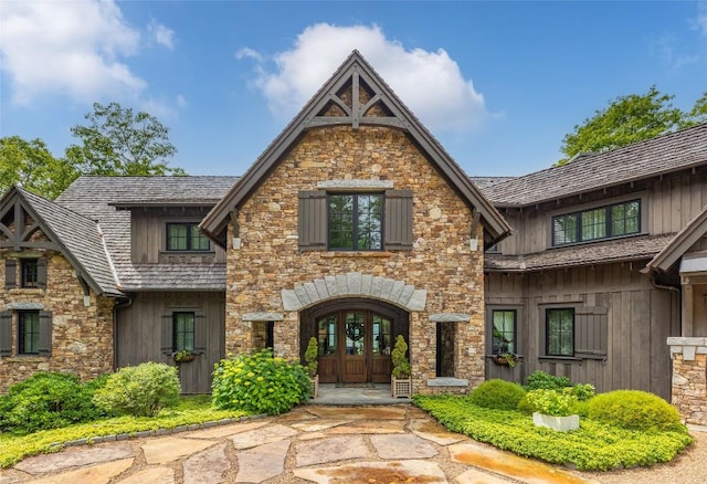 39 Firesong Ln, Glenville, NC 28736 - view of front of property with french doors, stone siding, and board and batten siding