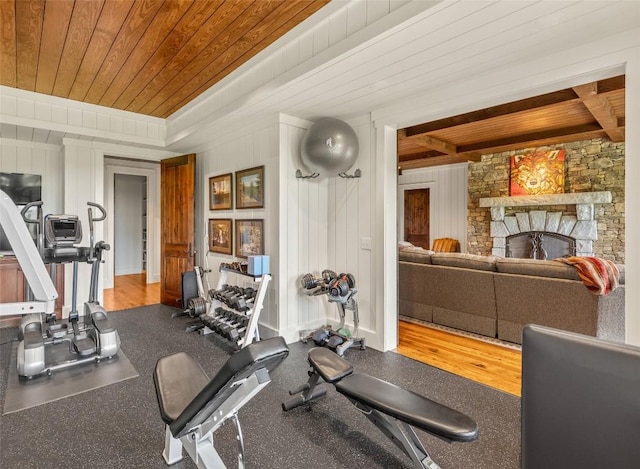 39 Firesong Ln, Glenville, NC 28736 - exercise room with wood ceiling and a stone fireplace