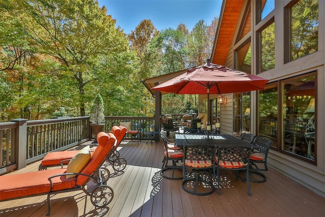 wooden deck with outdoor dining space