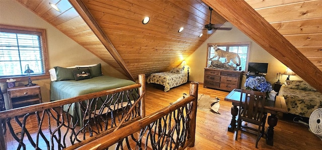 bedroom featuring lofted ceiling, wood finished floors, and wooden ceiling