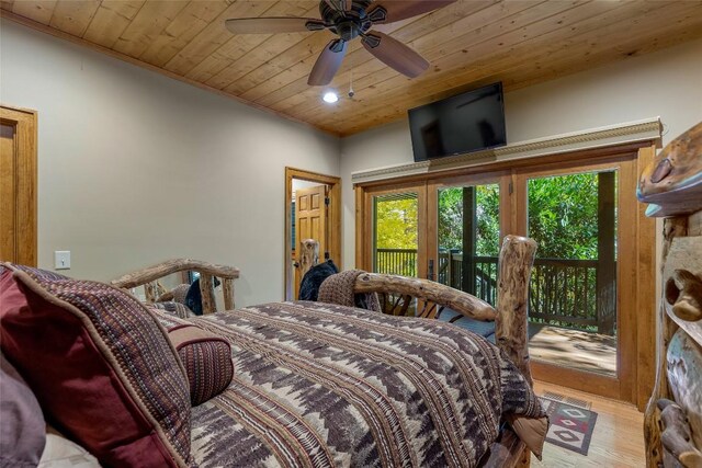 bedroom featuring wooden ceiling, access to exterior, and wood finished floors