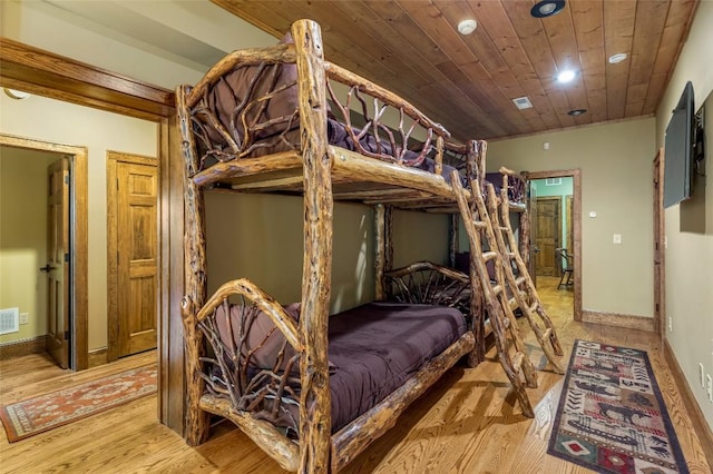 bedroom featuring wood ceiling, baseboards, recessed lighting, and light wood-style flooring