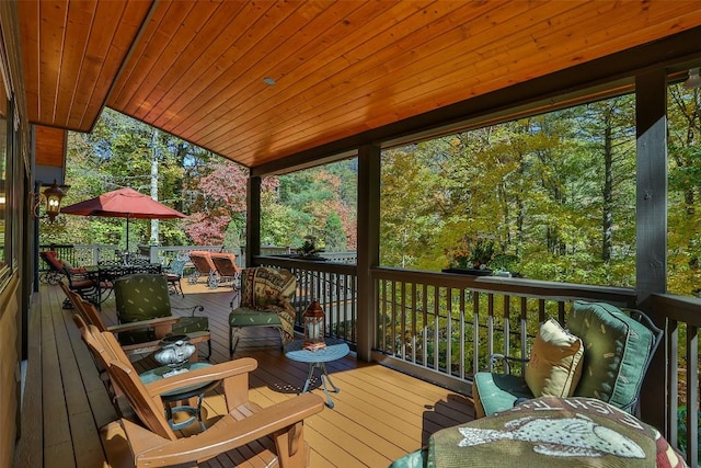 deck with outdoor dining area