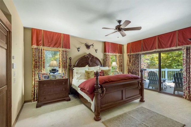 carpeted bedroom featuring access to outside and a ceiling fan