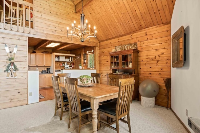 735 Trays Island Rd, Sapphire, NC 28774 - dining room with wood walls, light colored carpet, wood ceiling, and a chandelier