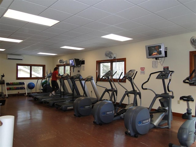 735 Trays Island Rd, Sapphire, NC 28774 - gym with a wall mounted air conditioner, healthy amount of natural light, and a drop ceiling